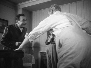 James (Barrymore) taking a swing at Rocco (Robinson) despite his infirmity